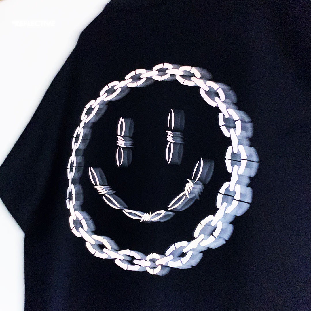 siyah oversize tişört zincir şeklinde gülen yüz reflektör baskılı dikenli acid lsd smiley baskılı tişört