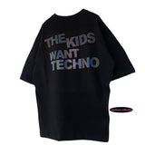 OVERSIZE SCHWARZES T-SHIRT „THE KIDS WANT TECHNO“ REFLEKTIEREND