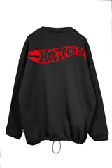 Unisex black oversize sweatshirt with 'Hot Techno' red flame graphic, ideal for techno and rave fans.