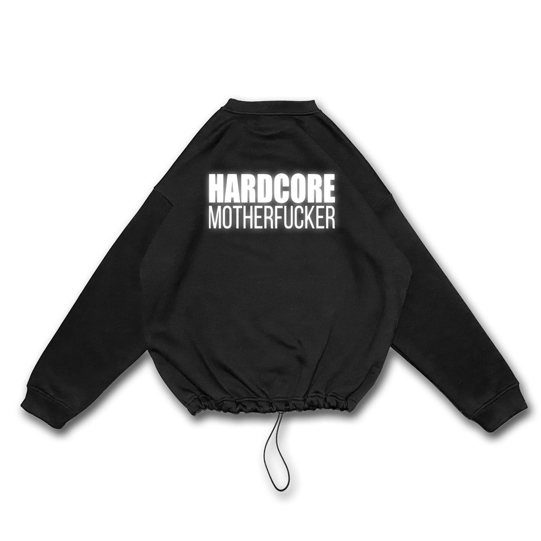 Unisex black oversize sweatshirt with 'HARDCORE MOTHERFUCKER' print, designed for rave lifestyle and techno party enthusiasts.